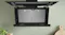 Open Bosch Series 8 rangehood showing the interior filter compartment for convenient access Open Bosch Series 8 rangehood showing the interior filter compartment for convenient access