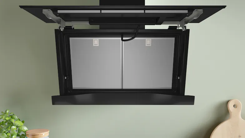 Open Bosch Series 8 rangehood showing the interior filter compartment for convenient access Open Bosch Series 8 rangehood showing the interior filter compartment for convenient access