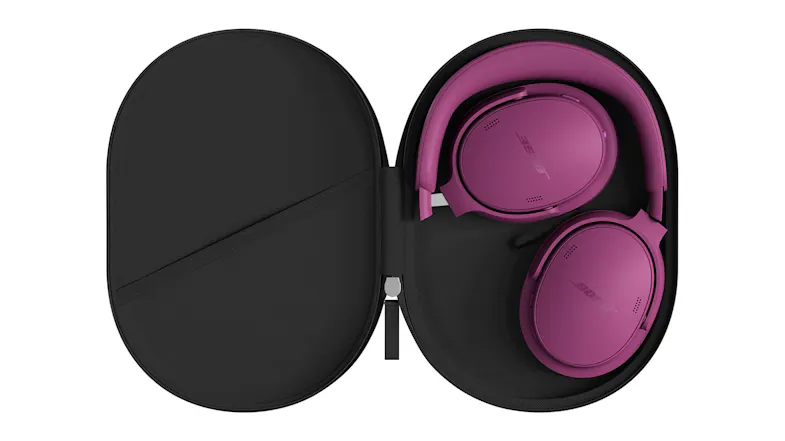 An open hard case showcasing folded headphones stored inside An open hard case showcasing folded headphones stored inside