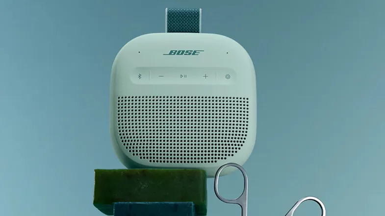 Lifestyle image of Bose portable Bluetooth speaker in Dewdrop Mint against a light blue background Lifestyle image of Bose portable Bluetooth speaker in Dewdrop Mint against a light blue background
