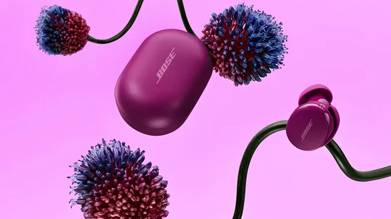 Bose QuietComfort wireless earbuds and charging case in Rosewood Mauve arranged with floral elements Bose QuietComfort wireless earbuds and charging case in Rosewood Mauve arranged with floral elements