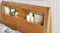 Close-up view of a wooden headboard featuring built-in lighting Close-up view of a wooden headboard featuring built-in lighting