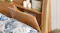Side view of a king headboard showing one hidden compartment Side view of a king headboard showing one hidden compartment