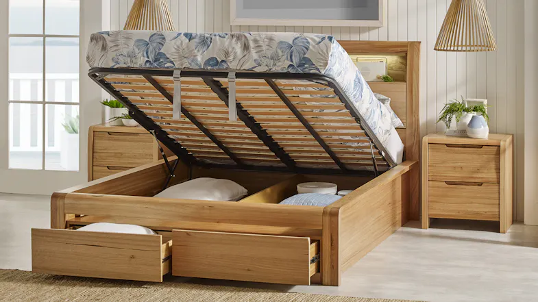 Front view of a bed featuring two bottom drawers opened Front view of a bed featuring two bottom drawers opened