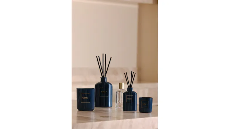 A view of the Moss St. room fragrance, scented candle, and reed diffuser products A view of the Moss St. room fragrance, scented candle, and reed diffuser products