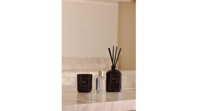 A view of the Moss St. room fragrance, scented candle, and reed diffuser products A view of the Moss St. room fragrance, scented candle, and reed diffuser products