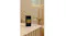 The room fragrance is displayed in a warmly-lit modern bathroom The room fragrance is displayed in a warmly-lit modern bathroom