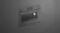 An angled view of the oven that's integrated into a grey wall An angled view of the oven that's integrated into a grey wall
