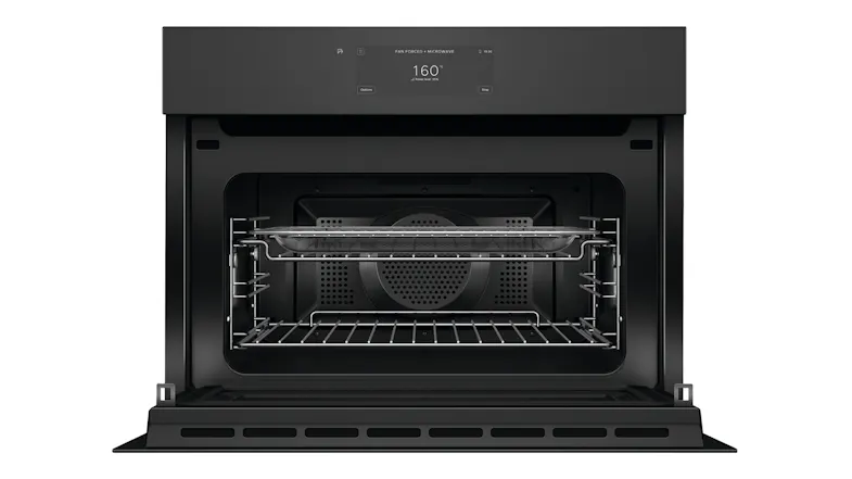 Open door view of Fisher & Paykel combi-microwave showing interior racks and baking tray Open door view of Fisher & Paykel combi-microwave showing interior racks and baking tray