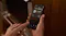 Person holding a smartphone using the smart appliance app to monitor Fisher & Paykel oven temperature Person holding a smartphone using the smart appliance app to monitor Fisher & Paykel oven temperature