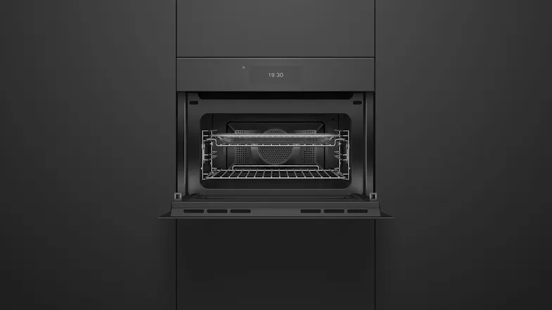 Integrated Fisher & Paykel Series 11 black glass microwave with open door showing internal cooking racks Integrated Fisher & Paykel Series 11 black glass microwave with open door showing internal cooking racks