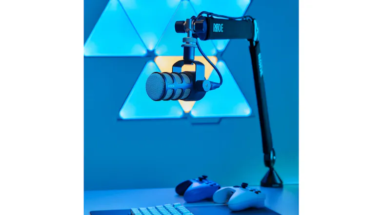 Modern workstation showcasing the boom arm and microphone with controllers Modern workstation showcasing the boom arm and microphone with controllers