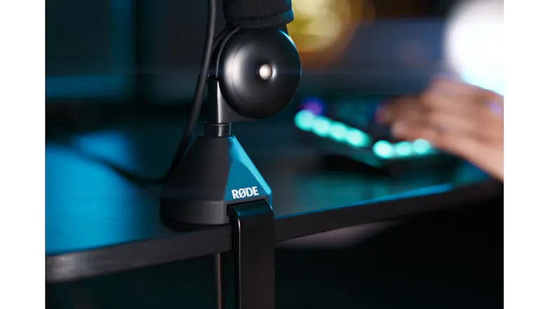 Close-up view highlighting the desk clamp attachment of the boom arm Close-up view highlighting the desk clamp attachment of the boom arm