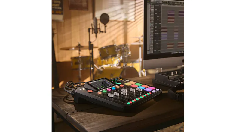 Studio desk setup showcasing the production console near a computer Studio desk setup showcasing the production console near a computer