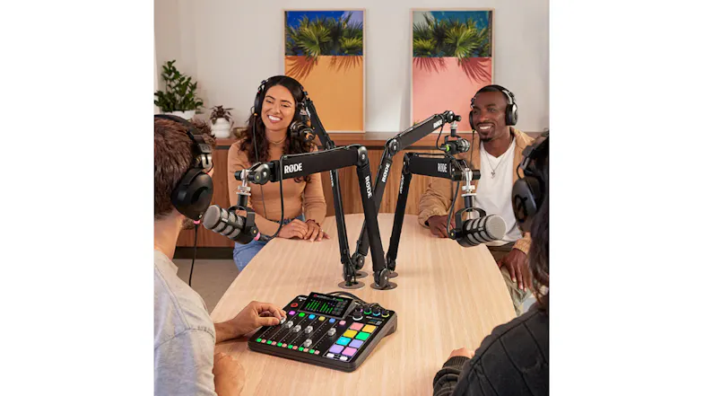 Group podcast setup featuring four people using the audio console Group podcast setup featuring four people using the audio console