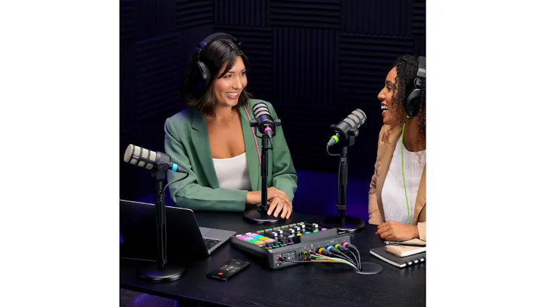 Two podcast hosts talking with microphones and the console on a table Two podcast hosts talking with microphones and the console on a table