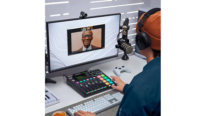 Person using the audio console during a video call on a desktop screen Person using the audio console during a video call on a desktop screen