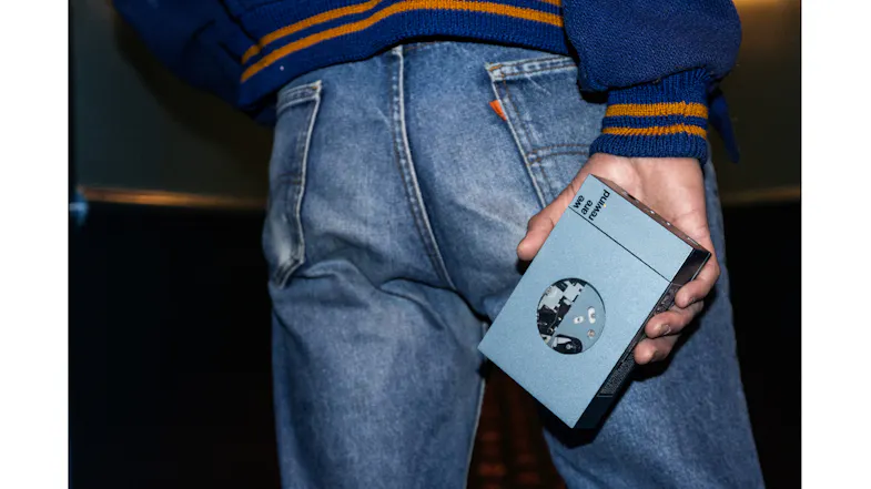 Lifestyle image of a person carrying the blue We Are Rewind Kurt cassette player Lifestyle image of a person carrying the blue We Are Rewind Kurt cassette player