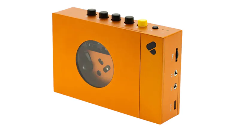 Angled front-side view of the orange cassette player showcasing the control buttons Angled front-side view of the orange cassette player showcasing the control buttons