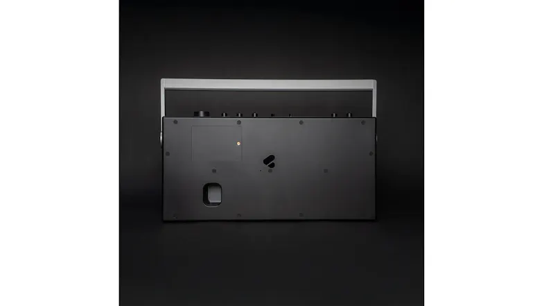 Rear view of the We Are Rewind Blaster Curtis boombox showing the back panel, ports, and handle design Rear view of the We Are Rewind Blaster Curtis boombox showing the back panel, ports, and handle design