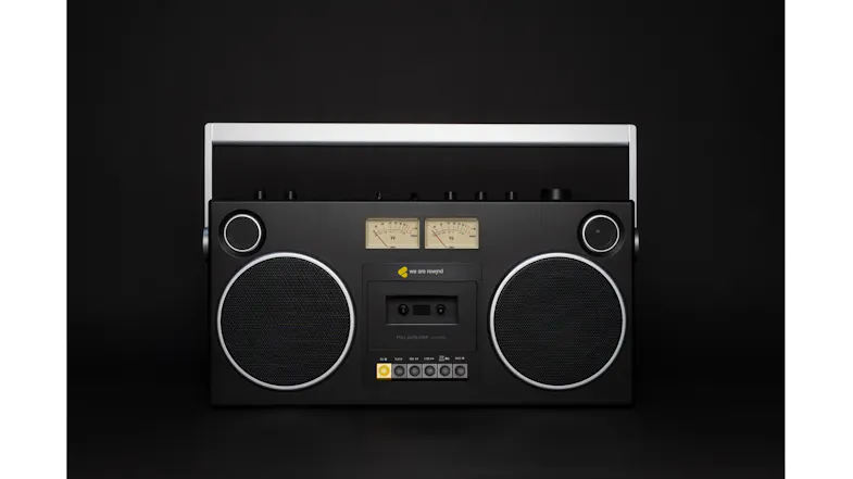 Centred front view of the boombox, featuring twin speakers, cassette deck, and top-mounted controls Centred front view of the boombox, featuring twin speakers, cassette deck, and top-mounted controls
