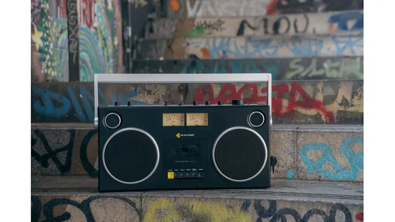 Front view of the black Bluetooth boombox displayed against a graffiti-covered urban backdrop Front view of the black Bluetooth boombox displayed against a graffiti-covered urban backdrop