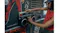 Close-up of hands operating the boombox's cassette compartment and controls Close-up of hands operating the boombox's cassette compartment and controls