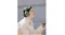 Side view of a woman using a smartphone while using the WH-1000XM6 headphones Side view of a woman using a smartphone while using the WH-1000XM6 headphones