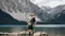 Couple posing on a log in a calm mountain lake while recording with a 360-action camera on a selfie stick Couple posing on a log in a calm mountain lake while recording with a 360-action camera on a selfie stick