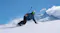 A snowboarder carving down a snowy slope near mountains while holding a 360-action camera on an invisible stick A snowboarder carving down a snowy slope near mountains while holding a 360-action camera on an invisible stick