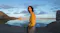 Young man in a yellow jacket standing outdoors beside a reflective desert lake during golden hour Young man in a yellow jacket standing outdoors beside a reflective desert lake during golden hour