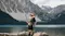 Couple standing on a log in a mountain lake, man holding an extended selfie stick with a 360-action camera Couple standing on a log in a mountain lake, man holding an extended selfie stick with a 360-action camera
