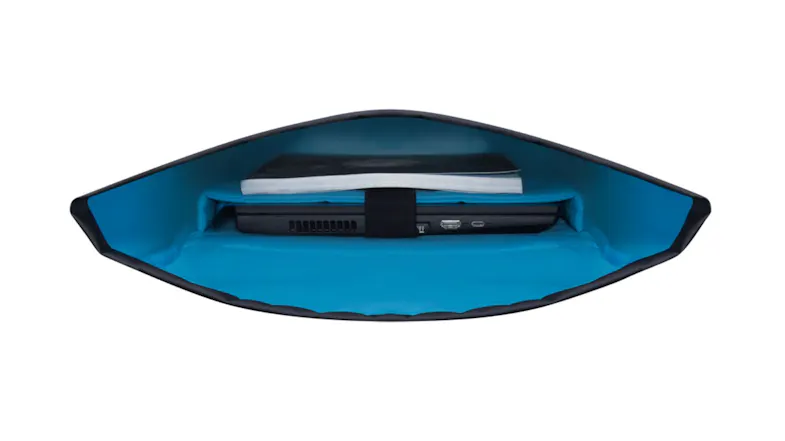 Interior view of Lenovo gaming backpack showing padded laptop compartment with blue lining Interior view of Lenovo gaming backpack showing padded laptop compartment with blue lining