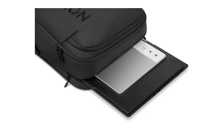 Close-up of Lenovo Legion laptop sliding into backpack's dedicated compartment Close-up of Lenovo Legion laptop sliding into backpack's dedicated compartment