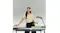 Woman in office featuring Bose QuietComfort headphones while holding paper Woman in office featuring Bose QuietComfort headphones while holding paper