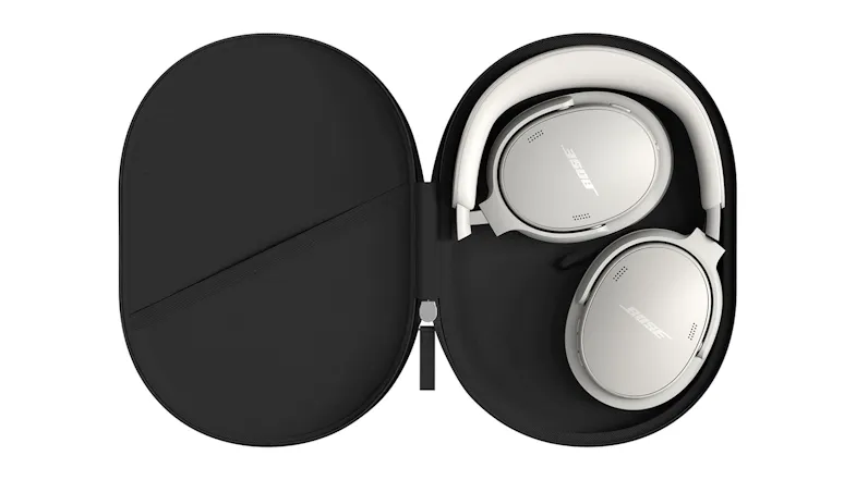 An open hard case showcasing folded headphones stored inside An open hard case showcasing folded headphones stored inside