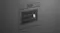 An angled view of a built-in dark grey Fisher & Paykel wall oven with an illuminated interior An angled view of a built-in dark grey Fisher & Paykel wall oven with an illuminated interior