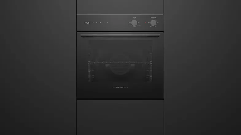 Contemporary 6 functions built-in oven seamlessly installed within custom kitchen cabinetry Contemporary 6 functions built-in oven seamlessly installed within custom kitchen cabinetry