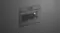 Angled view of a dark grey Fisher & Paykel oven built into matte black cabinetry with interior light turned on Angled view of a dark grey Fisher & Paykel oven built into matte black cabinetry with interior light turned on