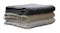 Stack of three folded textured Baksana Lisbon Bath Mats in charcoal, beige, and white Stack of three folded textured Baksana Lisbon Bath Mats in charcoal, beige, and white