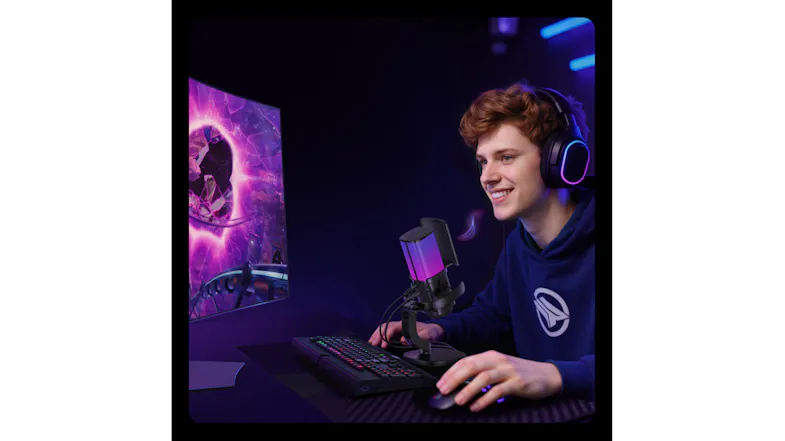 Gaming content creator setup with RGB microphone, headset, and immersive desktop display Gaming content creator setup with RGB microphone, headset, and immersive desktop display