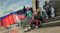 Street soccer scene featuring players seated together on concrete steps Street soccer scene featuring players seated together on concrete steps
