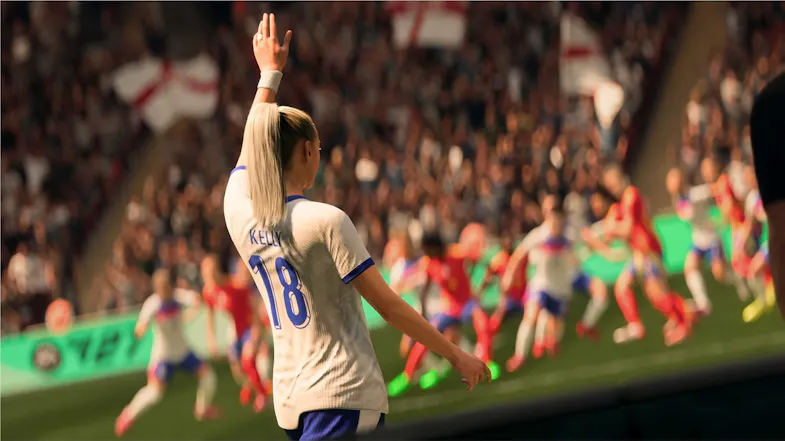 Female soccer player raising her arm, showcasing a cheering crowd Female soccer player raising her arm, showcasing a cheering crowd