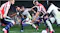 Game scene featuring multiple players contesting the soccer ball Game scene featuring multiple players contesting the soccer ball