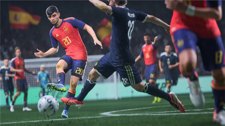 Match scene highlighting players in red and blue kits on the pitch Match scene highlighting players in red and blue kits on the pitch