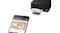 Epson printer with smartphone highlighting wireless printing functionality Epson printer with smartphone highlighting wireless printing functionality