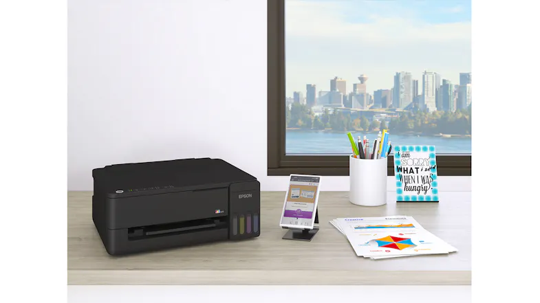 Modern desk setup showcasing an Epson printer near a window Modern desk setup showcasing an Epson printer near a window
