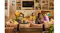 Several people gathered in a living room with the Sonos Beam Ultra soundbar beneath a television Several people gathered in a living room with the Sonos Beam Ultra soundbar beneath a television
