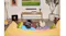 Rear view of a living room showing viewers watching television with the Sonos soundbar beneath the screen Rear view of a living room showing viewers watching television with the Sonos soundbar beneath the screen
