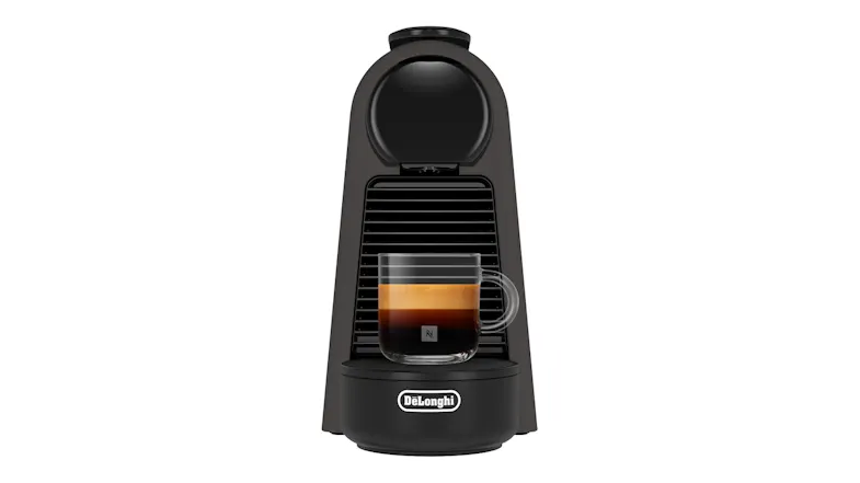 DeLonghi Essenza Mini machine with a clear glass mug of espresso on the drip tray DeLonghi Essenza Mini machine with a clear glass mug of espresso on the drip tray
